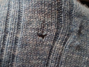 Moth hole in sweater, from goodreasonblog.com